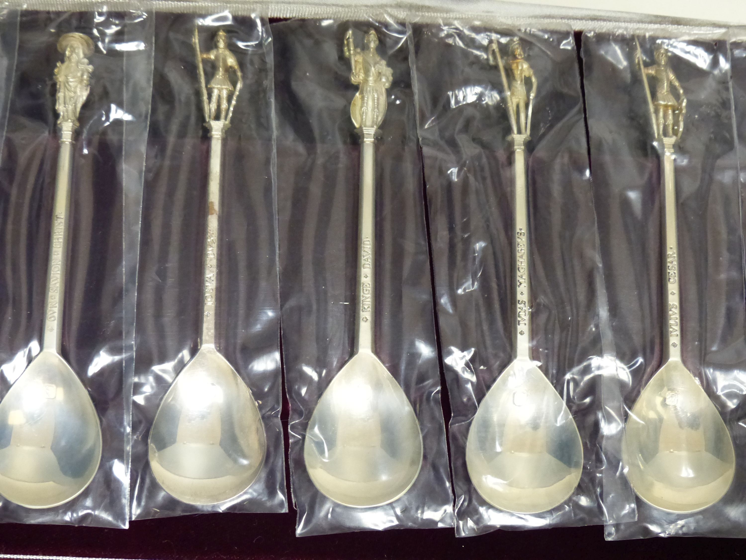 A set of silver limited edition 'Tichborne' spoons, cased and a collection of silver and enamel souvenir spoons